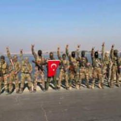 Süleyman Şah Türbesi yakınlarında Türk Bayrağı açılarak bozkurt selamı verildi