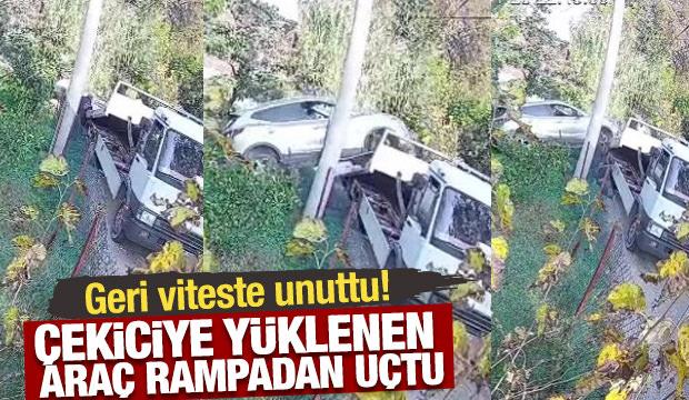Geri viteste unuttu! Çekiciye yüklenen araç rampadan uçtu
