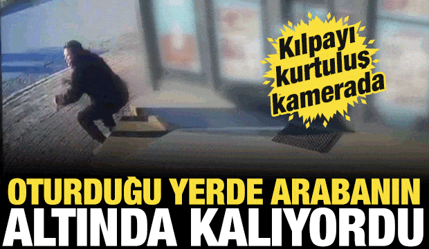 Oturduğu yerde aracın altında kalmaktan saniyelerle ile kurtuldu
