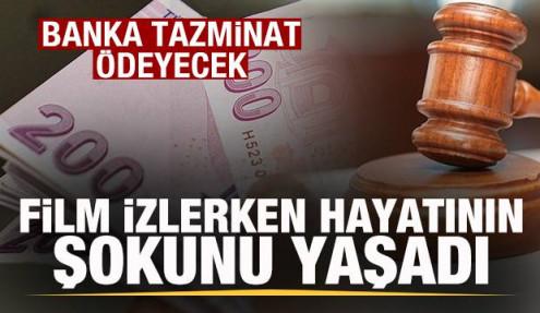 Telefonunda film izlerken hayatının şokunu yaşadı! Banka tazminat ödeyecek