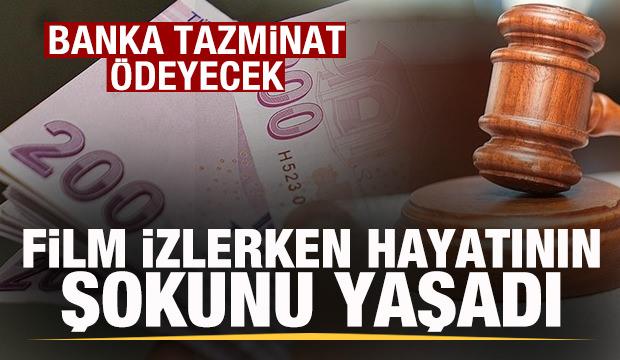 Telefonunda film izlerken hayatının şokunu yaşadı! Banka tazminat &ouml;deyecek
