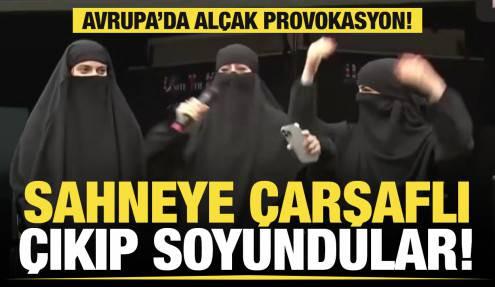 İngiltere'de infial yaratan görüntü: Sahneye çarşaflı çıkıp soyundular!
