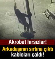 Arkadaşının sırtına çıkarak kabloyu çaldı