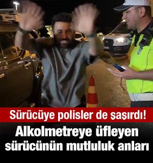Alkolmetreye &uuml;fleten s&uuml;r&uuml;c&uuml;n&uuml;n mutluluktan u&ccedil;tuğu anlar polisleri de şaşırttı