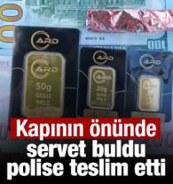 Kapının &ouml;n&uuml;nde servet buldu, polise teslim etti