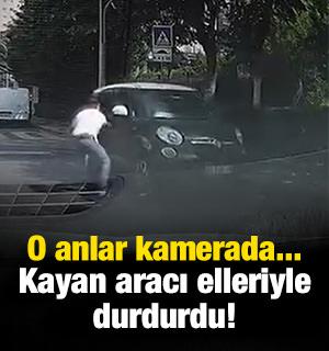 Başakşehir'de yokuşta kaymaya başlayan aracı elleriyle durdurdu!