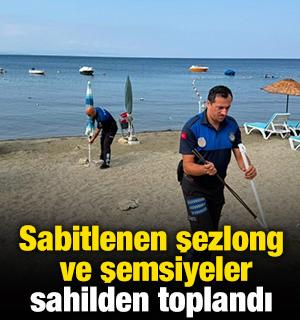 Sabitlenen şezlong ve şemsiyeler sahilden toplandı