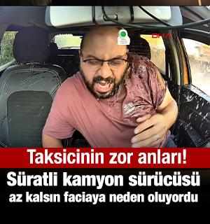Trafik canavarı kamyon s&uuml;r&uuml;c&uuml;s&uuml; az kalsın taksiyi bi&ccedil;iyordu