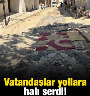 İzmir'de kazılan yolları belediye onarmadı! Vatandaşlar yollara halı serdi