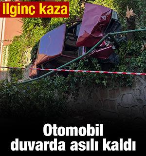 Otomobil istinat duvarında asılı kaldı