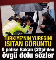 İ&ccedil;işleri Bakanı &Ccedil;ift&ccedil;i, kazada yaralanan gence şemsiye tutan trafik polisini tebrik etti